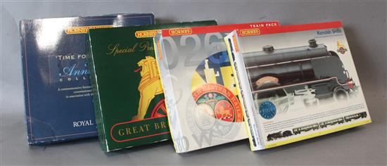 Four Hornby 00 train packs;